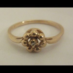 Dainty 14k yellow gold ring with tiny diamond
